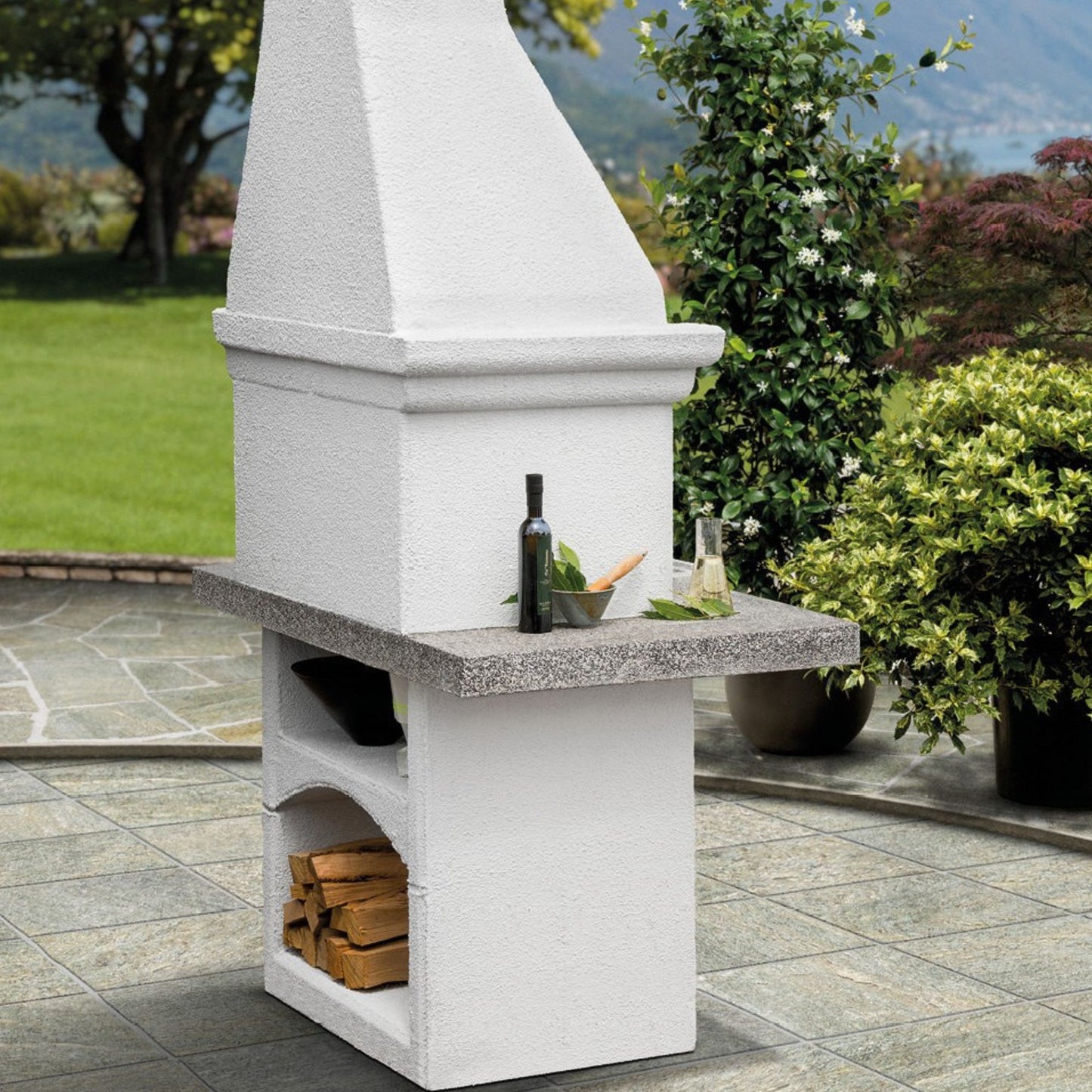 Barbecue a legna in cemento SALINA - PALAZZETTI con griglia regolabile, piano Marmotech e cassetto cenere Fast-Fire Box