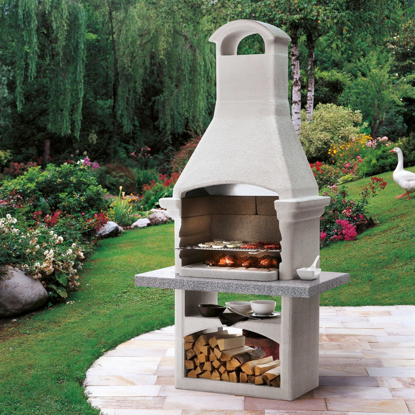 Barbecue a legna in cemento SALINA - PALAZZETTI con griglia regolabile, piano Marmotech e cassetto cenere Fast-Fire Box