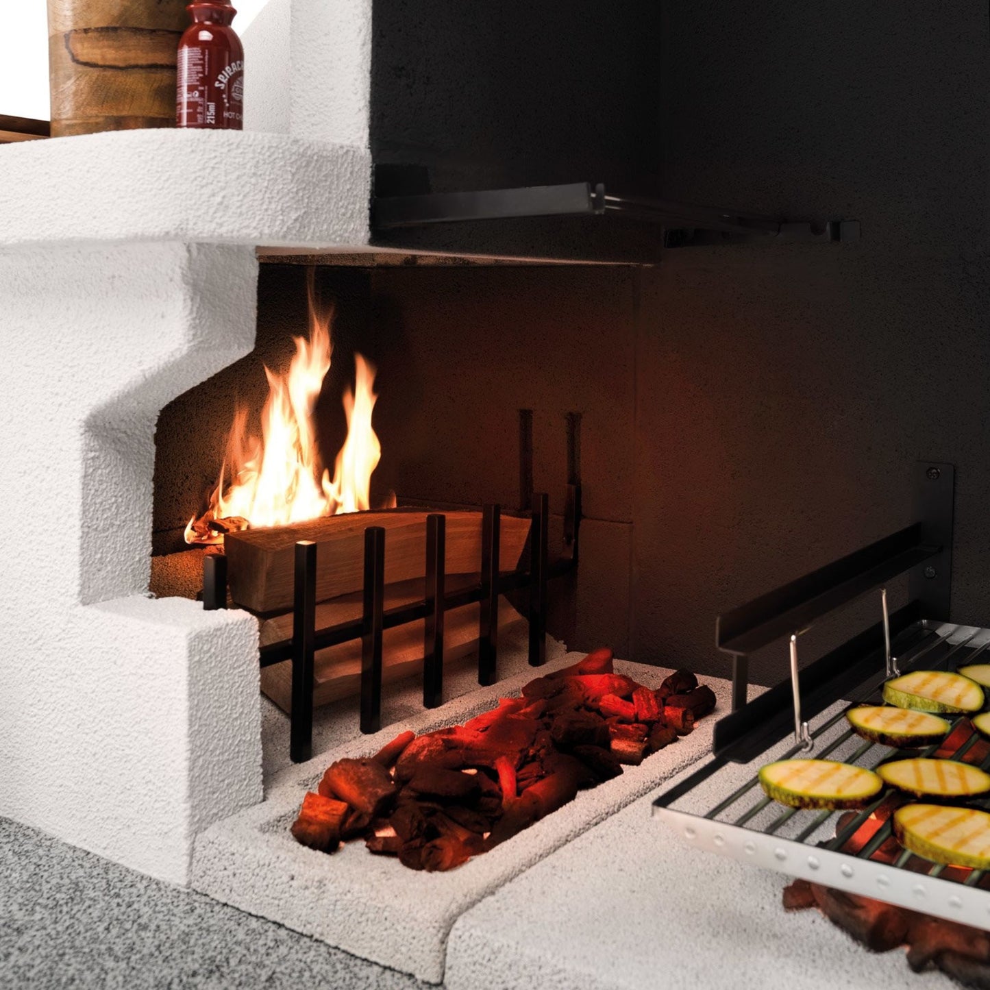 Barbecue in cemento a legna TRINIDAD con griglia extra large - PALAZZETTI braciere laterale, piano Marmotech e struttura in cemento