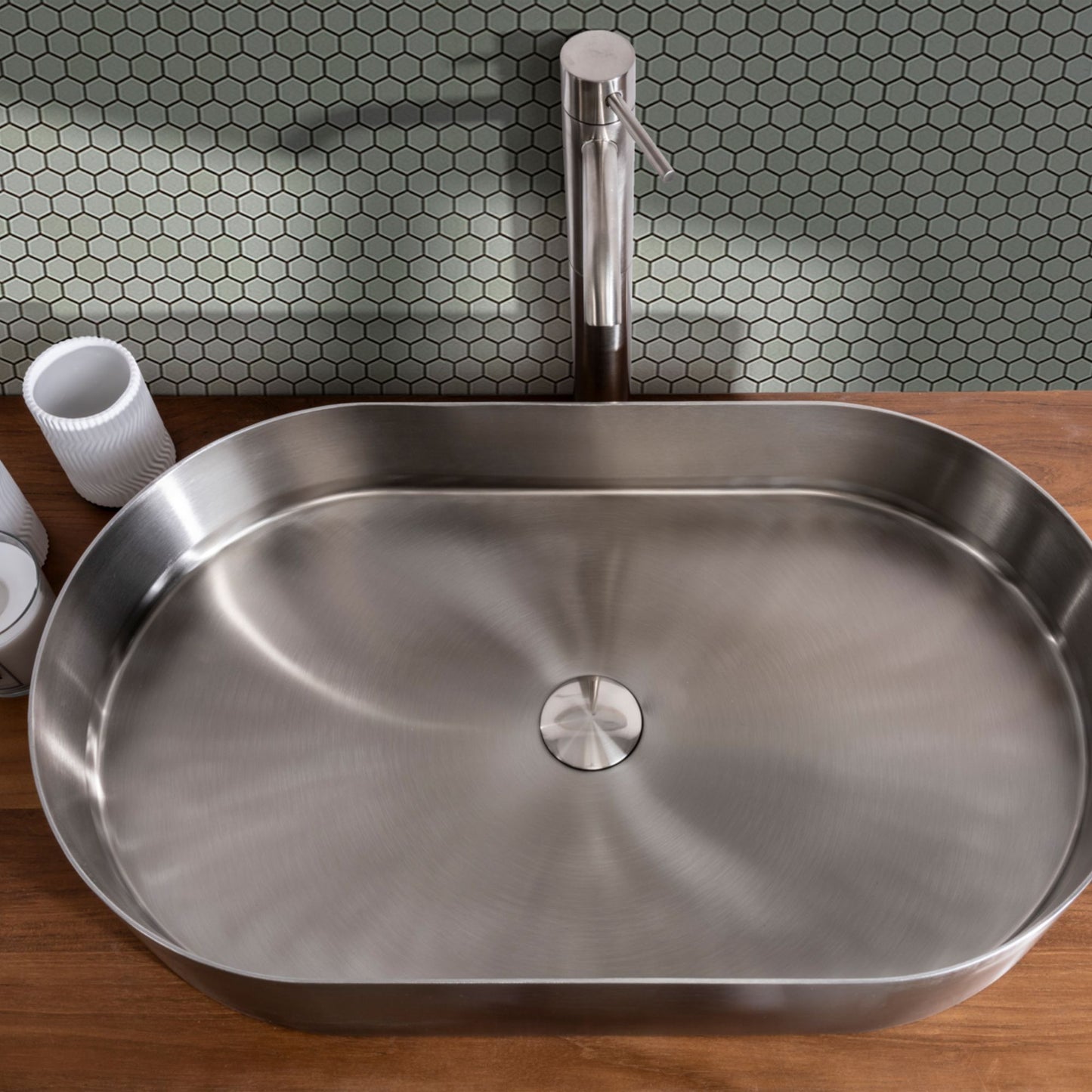 LAVABO FOYER OVALE in acciaio inox PVD - CIPÍ lavandino Design sottile, saldatura invisibile e forma ellittica elegante