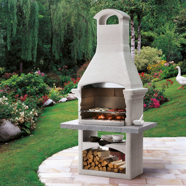 Barbecue a legna in cemento SALINA - PALAZZETTI con griglia regolabile, piano Marmotech e cassetto cenere Fast-Fire Box
