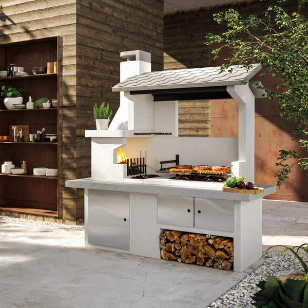 Barbecue in cemento a legna TRINIDAD con griglia extra large - PALAZZETTI braciere laterale, piano Marmotech e struttura in cemento