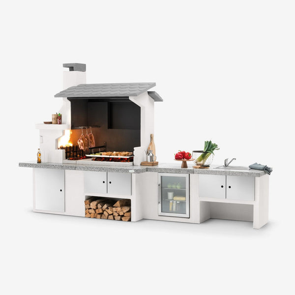 Barbecue in cemento a legna TRINIDAD con griglia extra large - PALAZZETTI braciere laterale, piano Marmotech e struttura in cemento