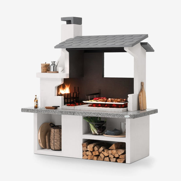 Barbecue in cemento a legna TRINIDAD con griglia extra large - PALAZZETTI braciere laterale, piano Marmotech e struttura in cemento
