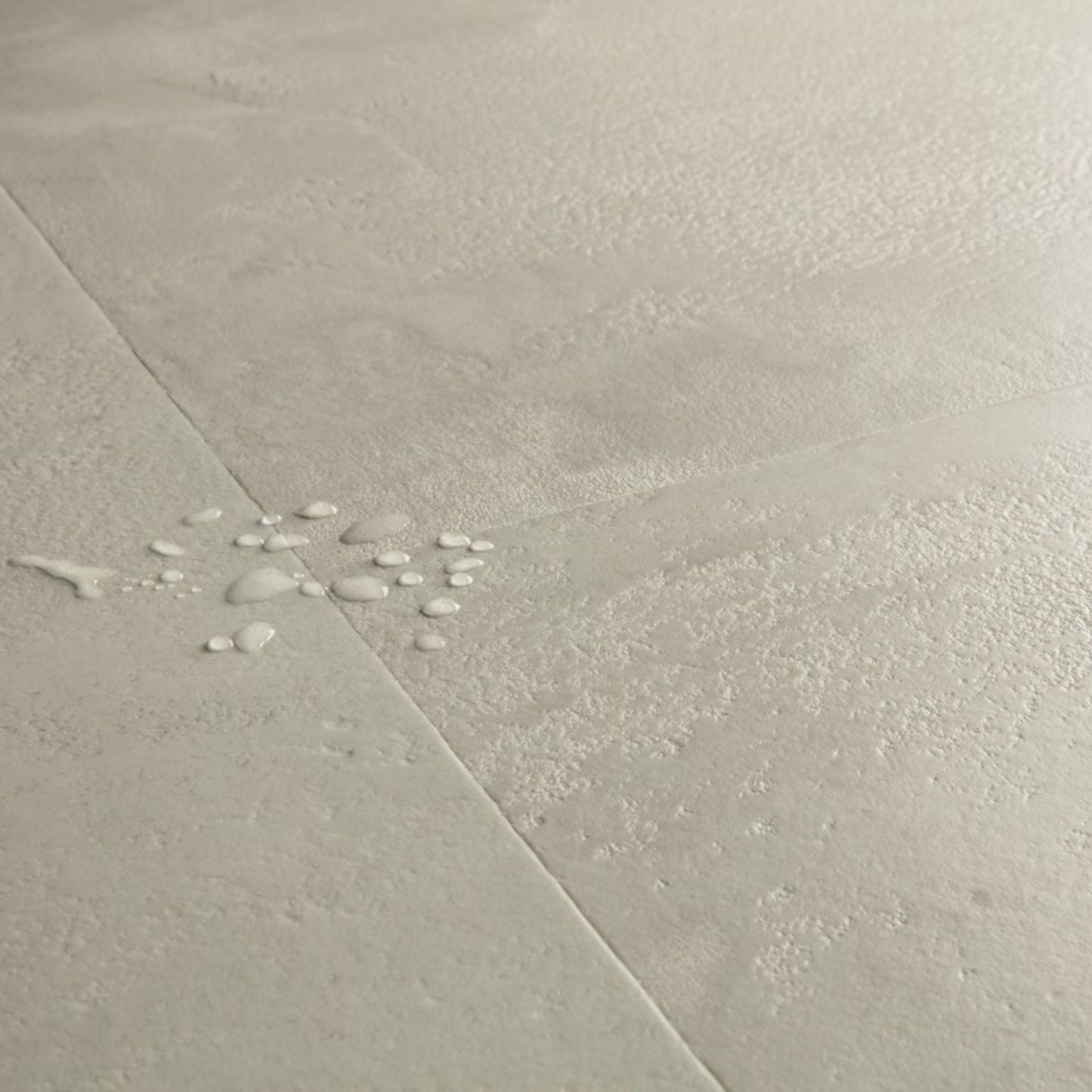 Pavimento in Laminato CAPTURE MUSE CEMENTO GRIGIO QUICK-STEP resistenza ai graffi e design effetto pietra per ambienti domestici ad alto utilizzo