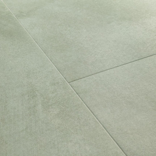 Pavimento in PVC ILLUME VERDE SOFT QUICK-STEP finitura effetto pietra con bisellatura naturale