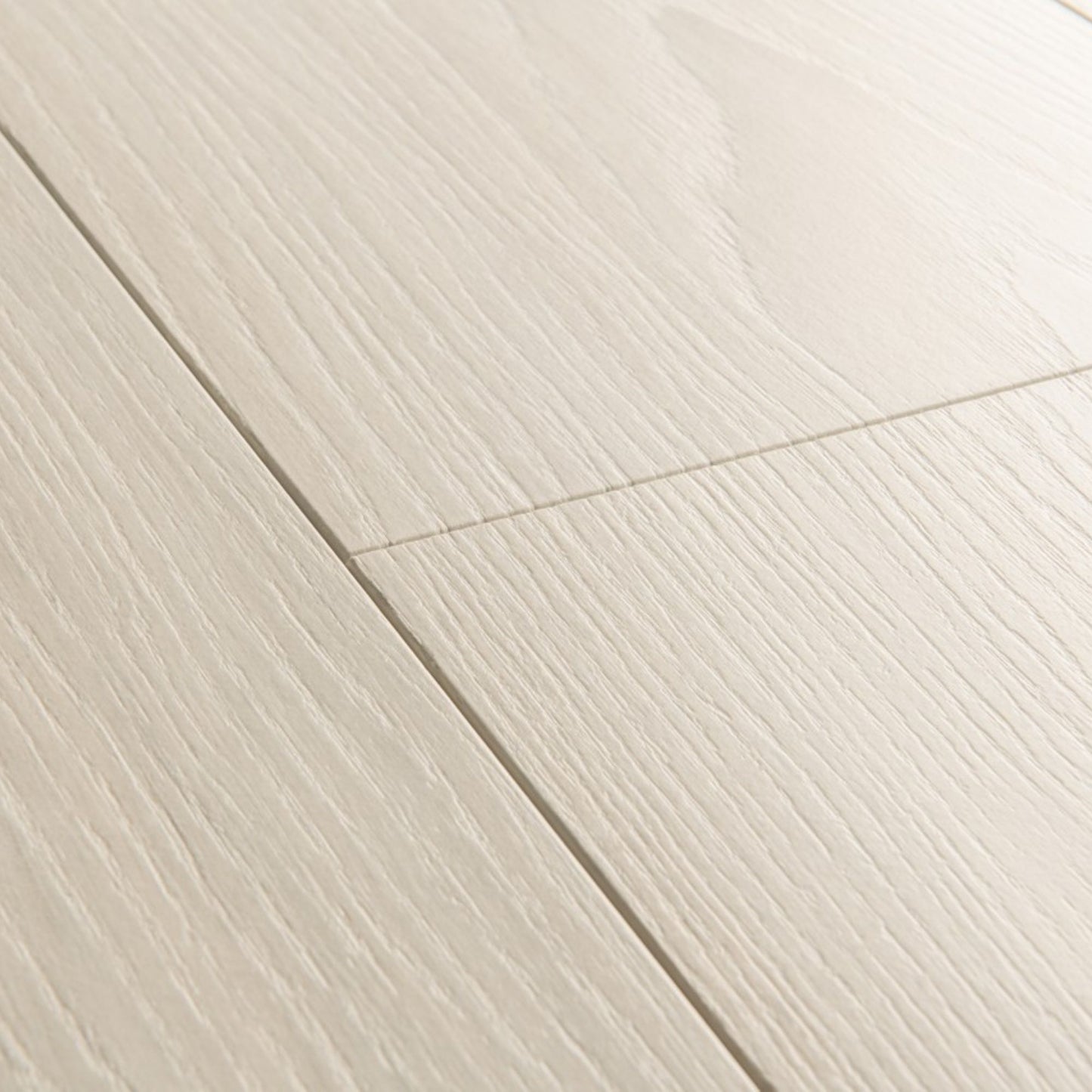 Pavimento in Laminato CAPTURE ROVERE PREMIUM BIANCO QUICK-STEP offre una tonalità luminosa e naturale valorizza spazi piccoli o poco illuminati
