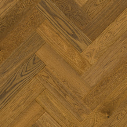 Pavimento in PARQUET DISEGNO ROVERE GREZZO CANNELLA EXTRA OPACO QUICK-STEP motivo a spina di pesce dona profondità e calore agli ambienti residenziali