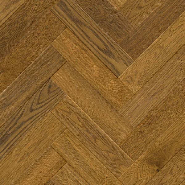 Pavimento in PARQUET DISEGNO ROVERE GREZZO CANNELLA EXTRA OPACO QUICK-STEP motivo a spina di pesce dona profondità e calore agli ambienti residenziali
