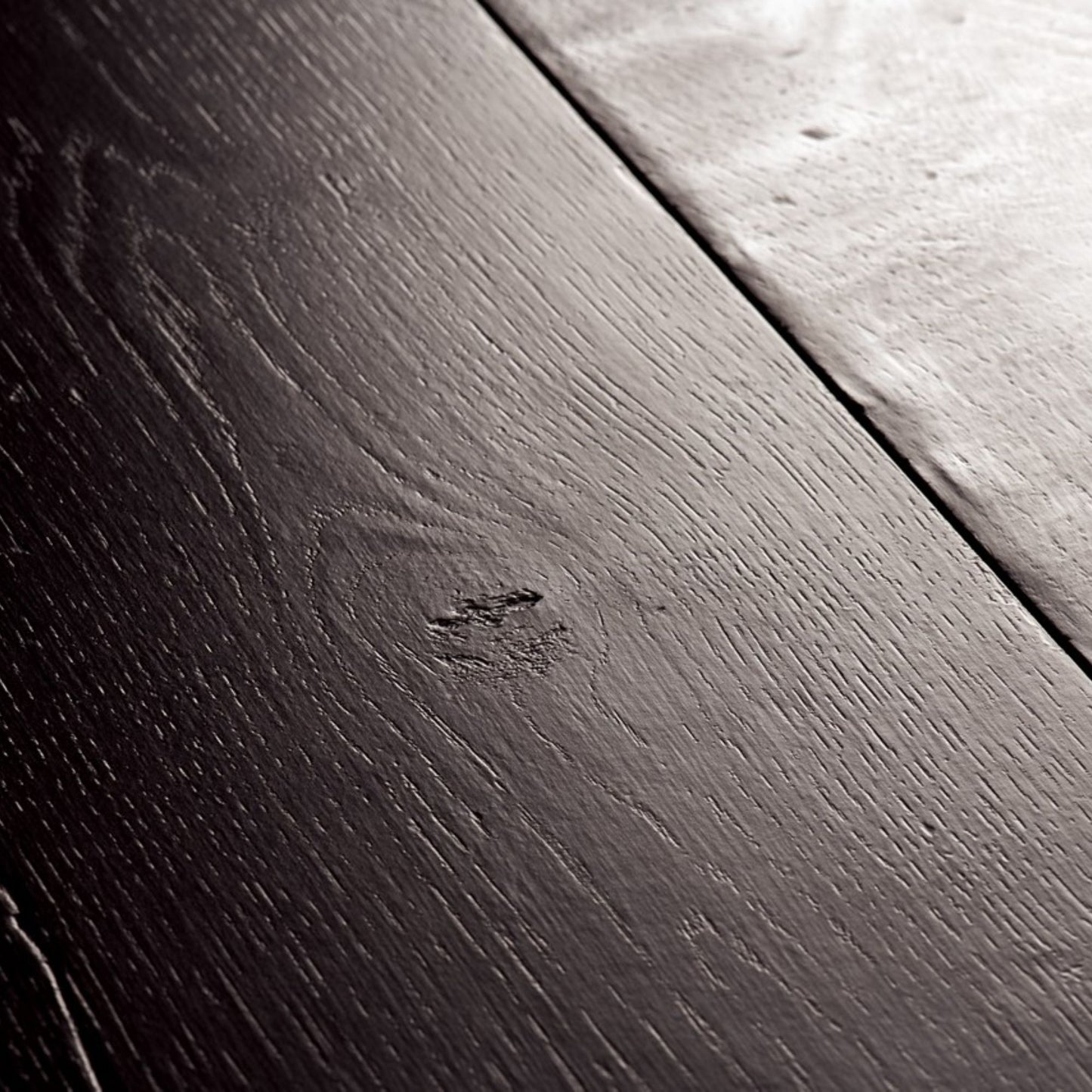 Pavimento in Laminato CAPTURE ROVERE TINTO NERO QUICK-STEP impermeabile, resistente ai graffi e compatibile con riscaldamento a pavimento