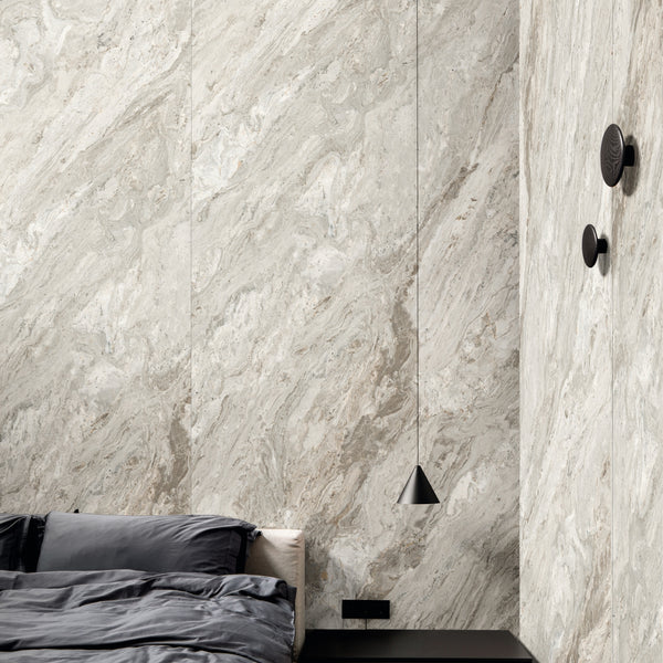 INFINITO 2.0 FONDOVALLE Marmi total black, grigi look naturale, marroni e bianchi dalle texture variegate e venature ampie