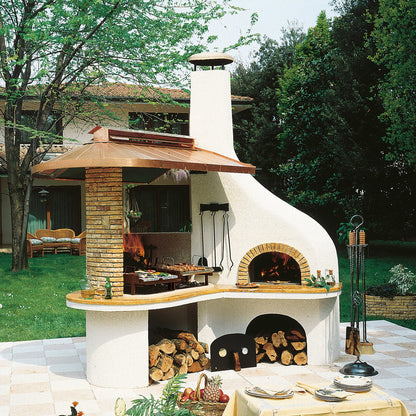 Barbecue in cemento con forno Vulcano Palazzetti marmo Giallo Reale e cappa in rame